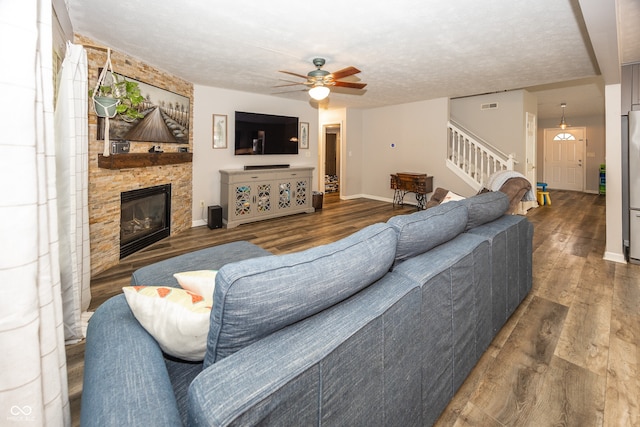14126 Stonewood Pl, Fishers, IN 46037 - living area with wood finished floors, stairs, ceiling fan, and a fireplace