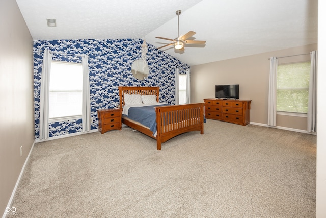 14126 Stonewood Pl, Fishers, IN 46037 - bedroom with vaulted ceiling, wallpapered walls, carpet floors, multiple windows, and a ceiling fan