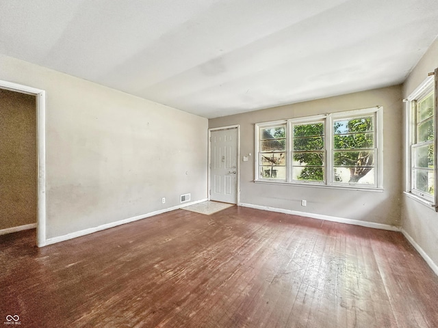 3505 N Emerson Ave, Indianapolis, IN 46218 - unfurnished room with healthy amount of natural light and hardwood / wood-style floors