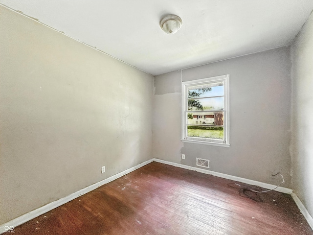 3505 N Emerson Ave, Indianapolis, IN 46218 - unfurnished room with wood finished floors and baseboards