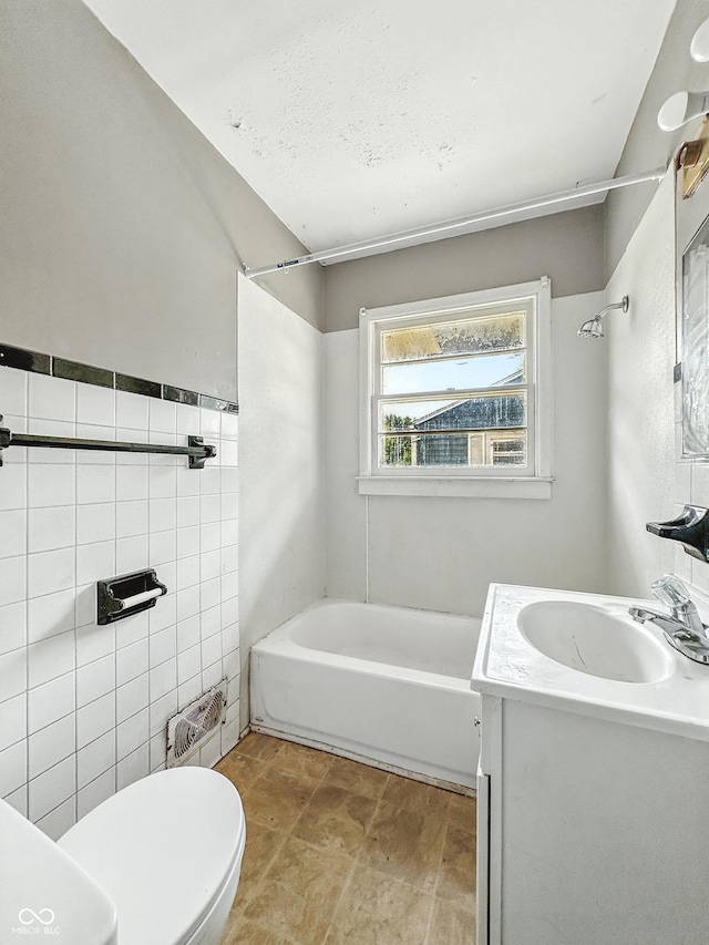 3505 N Emerson Ave, Indianapolis, IN 46218 - bathroom featuring vanity, tile walls, and  shower combination