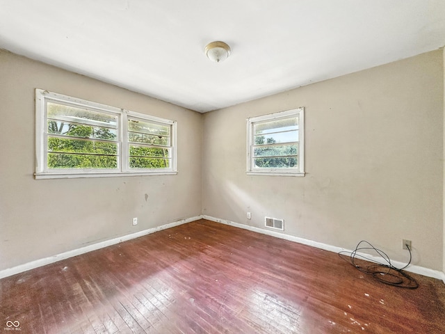 3505 N Emerson Ave, Indianapolis, IN 46218 - empty room with hardwood / wood-style flooring and baseboards