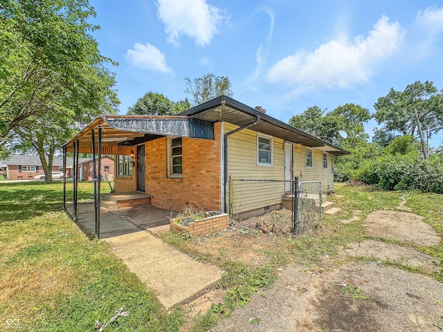3505 N Emerson Ave, Indianapolis, IN 46218 - view of side of home featuring a lawn and brick siding