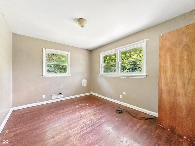 3505 N Emerson Ave, Indianapolis, IN 46218 - empty room with wood finished floors and baseboards