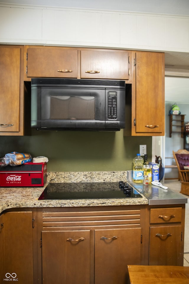 124 Georgton Ct, West Lafayette, IN 47906 - kitchen with black appliances, brown cabinets, and light countertops