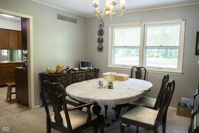124 Georgton Ct, West Lafayette, IN 47906 - dining space featuring ornamental molding, a chandelier, light carpet, and wooden walls