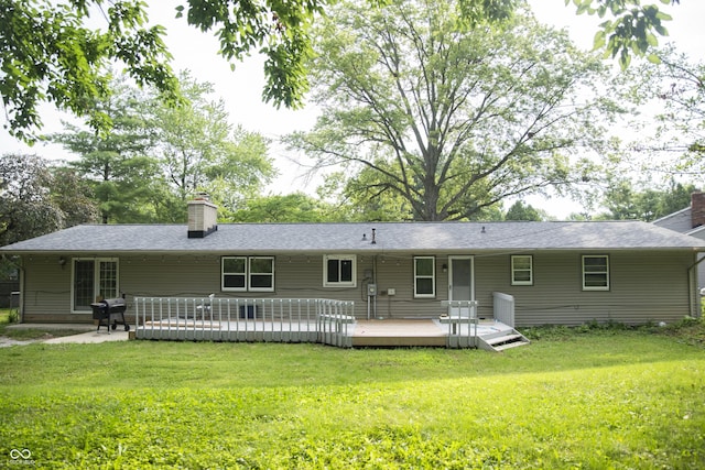 124 Georgton Ct, West Lafayette, IN 47906 - back of property featuring a chimney, a yard, and a wooden deck