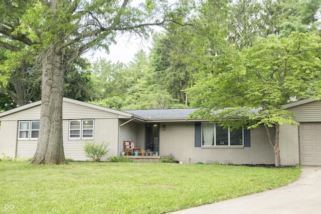 124 Georgton Ct, West Lafayette, IN 47906 - ranch-style house with an attached garage, a front yard, brick siding, roof with shingles, and driveway