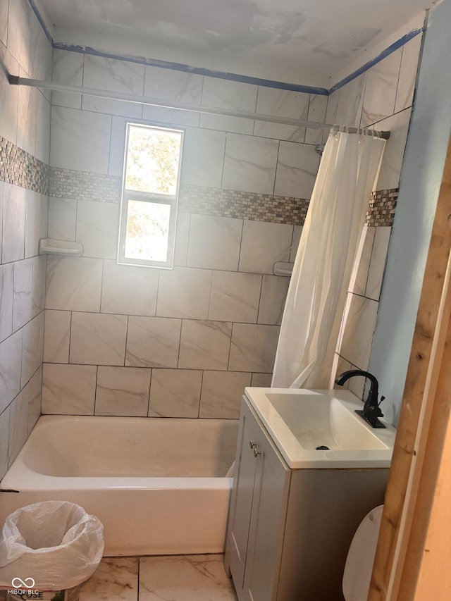 543 N Oakland Ave, Indianapolis, IN 46201 - full bathroom featuring shower / tub combo, marble look tiles, and vanity