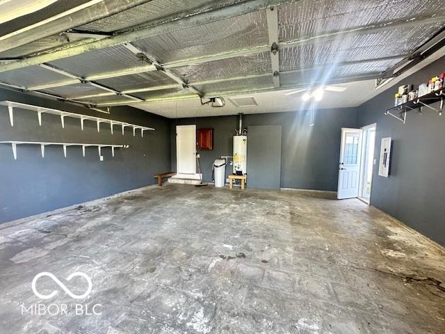 9490 N Keith Dr W, Columbus, IN 47203 - garage featuring water heater and a garage door opener