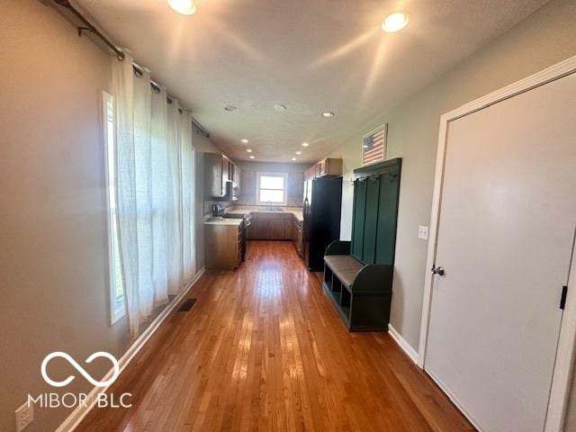 9490 N Keith Dr W, Columbus, IN 47203 - hallway with light wood-style flooring and recessed lighting