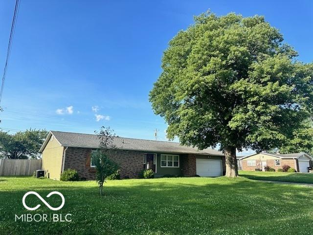 9490 N Keith Dr W, Columbus, IN 47203 - single story home with a garage and brick siding