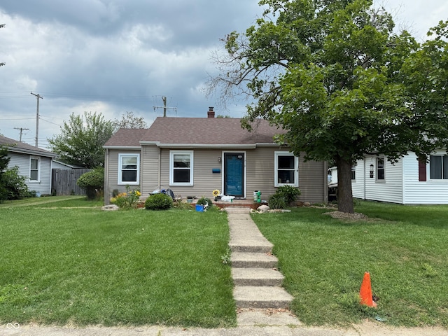 1918 14th St, Columbus, IN 47201 - bungalow-style house with a chimney and a shingled roof
