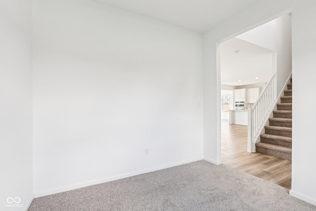 1186 Vera Blvd, Danville, IN 46122 - carpeted empty room featuring stairs and baseboards