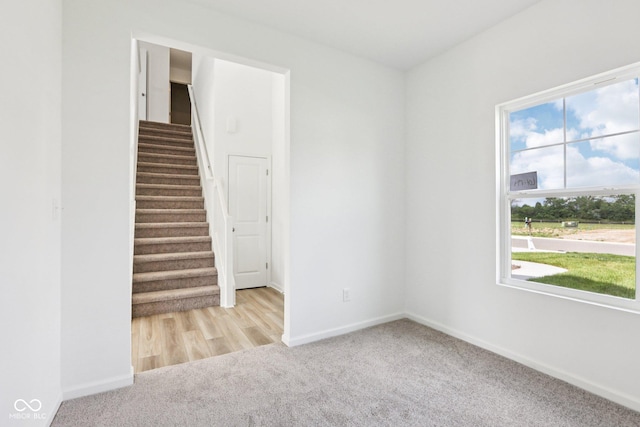 1186 Vera Blvd, Danville, IN 46122 - empty room with carpet flooring and stairs