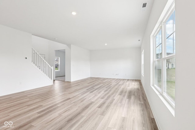 1186 Vera Blvd, Danville, IN 46122 - unfurnished room featuring light wood-type flooring, stairway, and recessed lighting