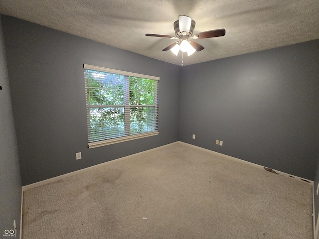 4293 Blue Spruce Ct, Greenwood, IN 46143 - spare room featuring ceiling fan, carpet flooring, and a textured ceiling