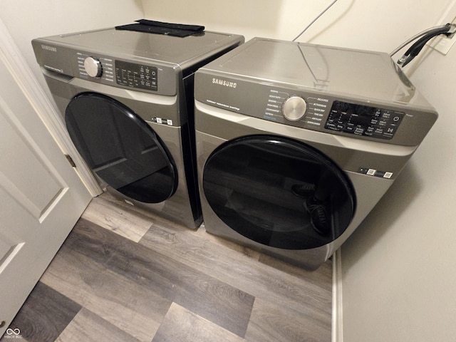 4293 Blue Spruce Ct, Greenwood, IN 46143 - washroom with washing machine and dryer and wood finished floors