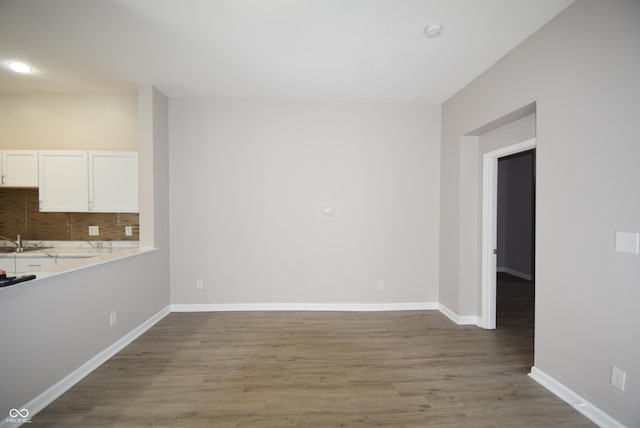 552 Jefferson Ave, Indianapolis, IN 46201 - unfurnished dining area with wood finished floors and baseboards