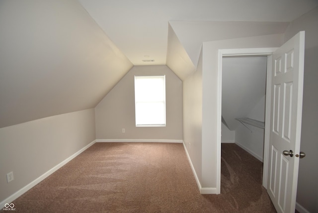 552 Jefferson Ave, Indianapolis, IN 46201 - additional living space featuring carpet flooring and vaulted ceiling