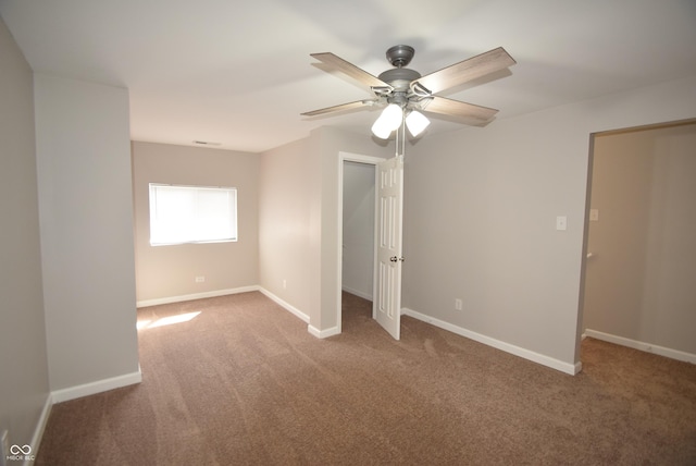 552 Jefferson Ave, Indianapolis, IN 46201 - unfurnished bedroom featuring carpet flooring and a ceiling fan