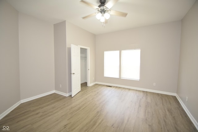 552 Jefferson Ave, Indianapolis, IN 46201 - unfurnished bedroom featuring wood finished floors and ceiling fan