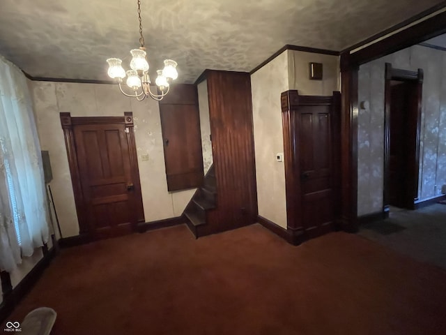 3220 E New York St, Indianapolis, IN 46201 - unfurnished dining area featuring a chandelier and dark colored carpet