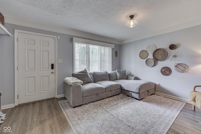 7444 Melanie Ln, Indianapolis, IN 46217 - living room with wood finished floors and a textured ceiling