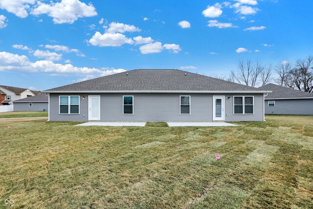 1431 Coen Ct, Columbus, IN 47201 - rear view of house with a patio, a lawn, and a shingled roof
