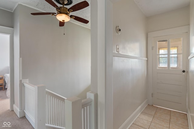 3055 N Washington Blvd, Indianapolis, IN 46205 - corridor featuring an upstairs landing and light tile patterned floors