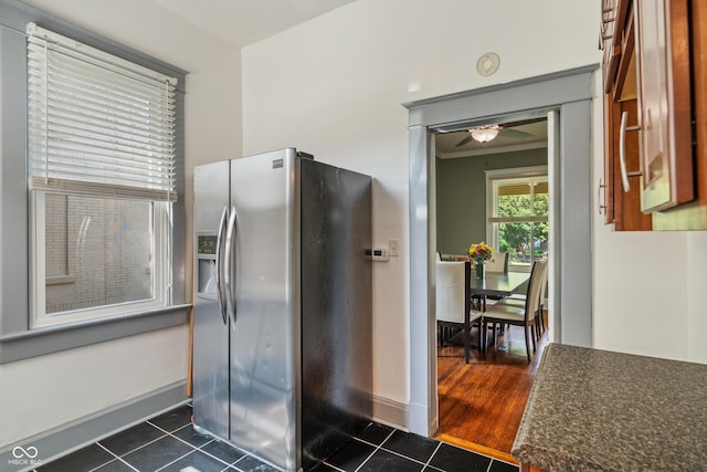 3055 N Washington Blvd, Indianapolis, IN 46205 - kitchen featuring stainless steel fridge with ice dispenser, dark tile patterned floors, dark countertops, and ceiling fan