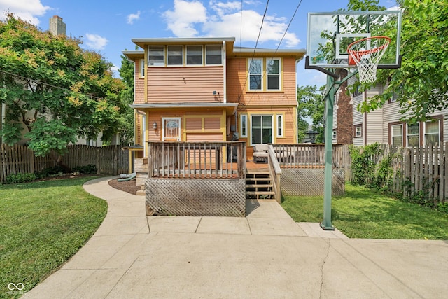 3055 N Washington Blvd, Indianapolis, IN 46205 - back of property with a fenced backyard and a wooden deck
