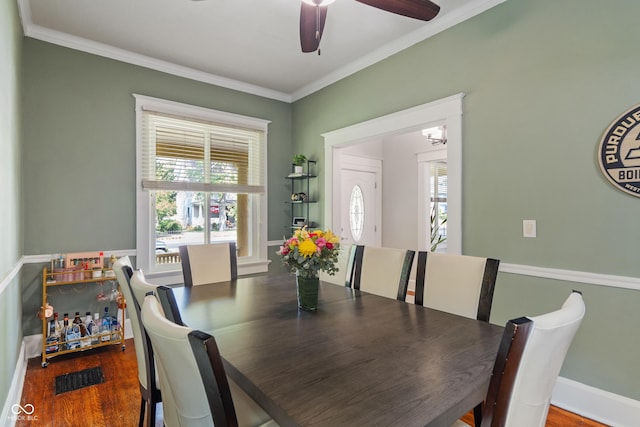3055 N Washington Blvd, Indianapolis, IN 46205 - dining space with plenty of natural light, crown molding, a ceiling fan, and wood finished floors