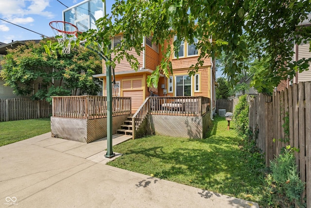 3055 N Washington Blvd, Indianapolis, IN 46205 - view of front facade featuring a fenced backyard, a wooden deck, and a patio