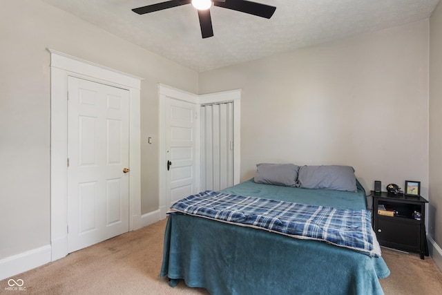3055 N Washington Blvd, Indianapolis, IN 46205 - bedroom with carpet flooring, a ceiling fan, and a closet