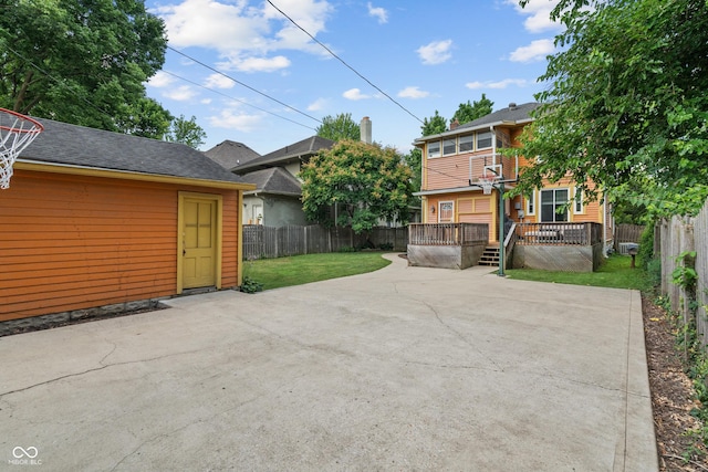 3055 N Washington Blvd, Indianapolis, IN 46205 - view of front of home featuring a patio area, a fenced backyard, and a wooden deck