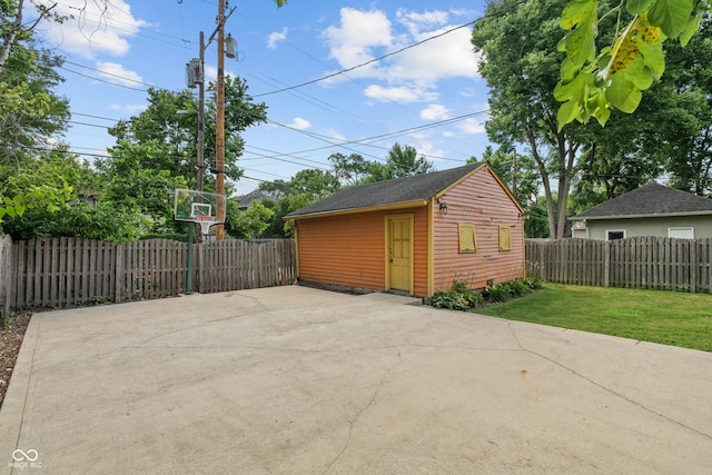 3055 N Washington Blvd, Indianapolis, IN 46205 - fenced backyard with an outbuilding and a patio area