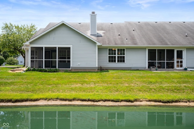 11628 Coastal Way, Indianapolis, IN 46229 - rear view of house featuring a sunroom, a water view, and a yard