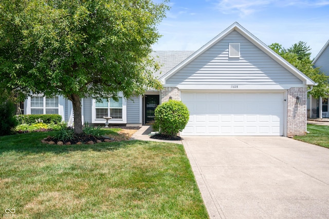 11628 Coastal Way, Indianapolis, IN 46229 - view of front facade featuring brick siding, driveway, a front yard, and a garage