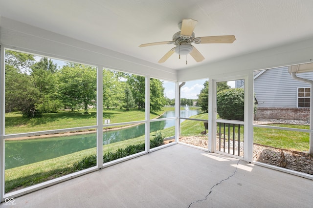 11628 Coastal Way, Indianapolis, IN 46229 - unfurnished sunroom featuring a water view, a ceiling fan, and view of wooded area
