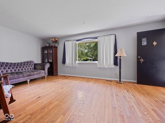 5530 Skyridge Dr, Indianapolis, IN 46250 - living room with hardwood / wood-style floors and baseboards