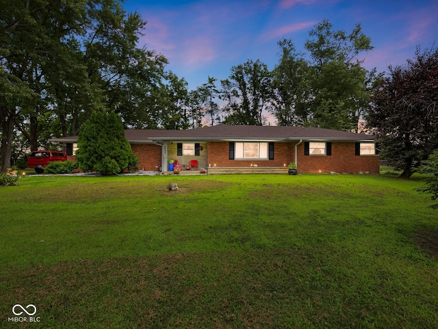 5530 Skyridge Dr, Indianapolis, IN 46250 - ranch-style home featuring brick siding and a yard