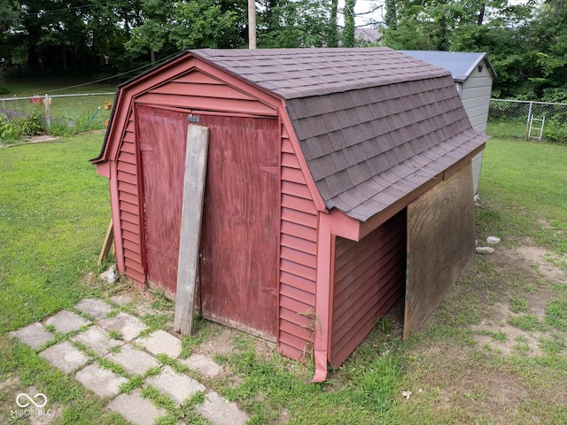 5530 Skyridge Dr, Indianapolis, IN 46250 - view of shed with a fenced backyard and view of wooded area