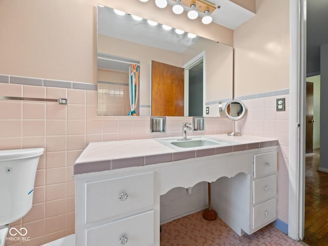 5530 Skyridge Dr, Indianapolis, IN 46250 - bathroom with tile walls, vanity, and wainscoting