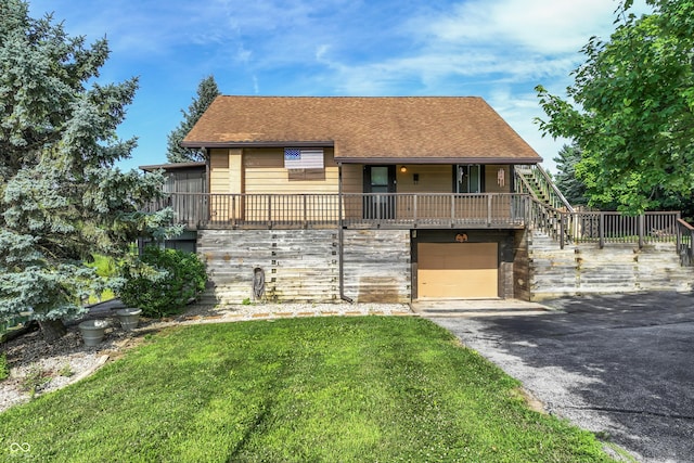 19120 Tomlinson Rd, Westfield, IN 46074 - view of front of home with stairs, a front lawn, a garage, asphalt driveway, and roof with shingles