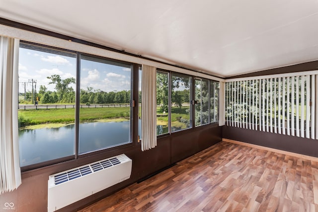 19120 Tomlinson Rd, Westfield, IN 46074 - unfurnished sunroom featuring plenty of natural light, radiator, wood finished floors, and view of wooded area