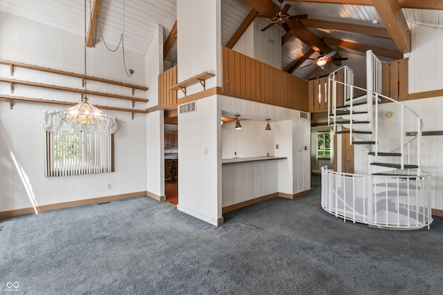 19120 Tomlinson Rd, Westfield, IN 46074 - unfurnished living room featuring dark carpet, high vaulted ceiling, a ceiling fan, stairway, and a chandelier