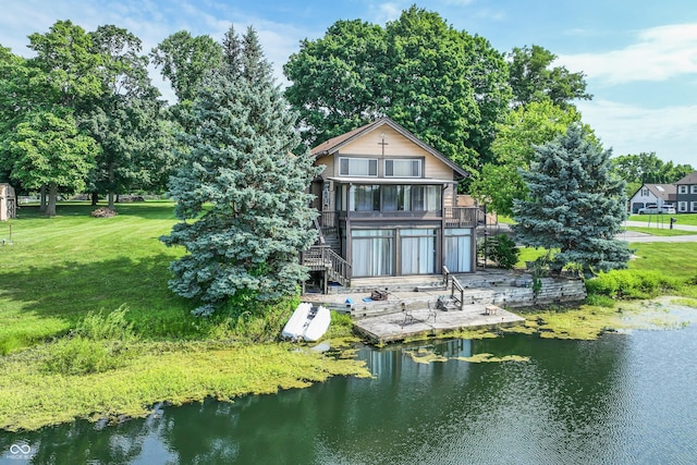 19120 Tomlinson Rd, Westfield, IN 46074 - rear view of house with stairs, a yard, and a water view