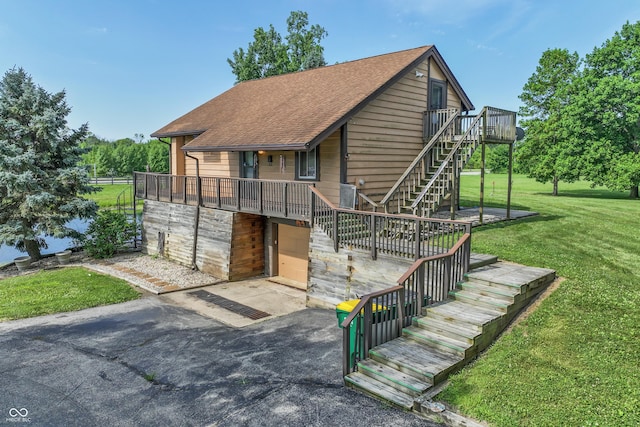 19120 Tomlinson Rd, Westfield, IN 46074 - chalet / cabin with stairway, a front yard, a shingled roof, and a deck