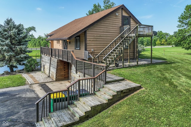 19120 Tomlinson Rd, Westfield, IN 46074 - back of house with stairway, a yard, a deck, and a shingled roof